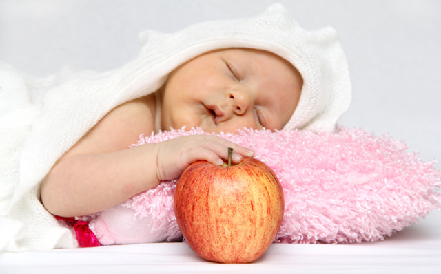 Baby with apple