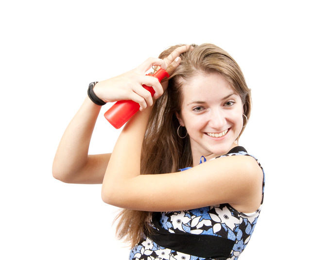 brunette girl with hair spray