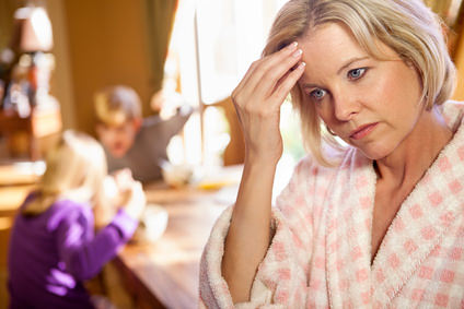 Mom overwhelmed while kids fight.