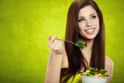 woman eating salad