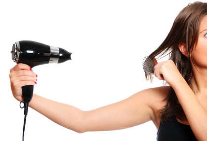 Woman and a hair dryer