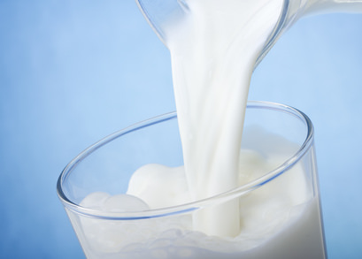 milk pouring into glass