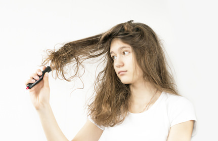 comb tangled in the girl's hair