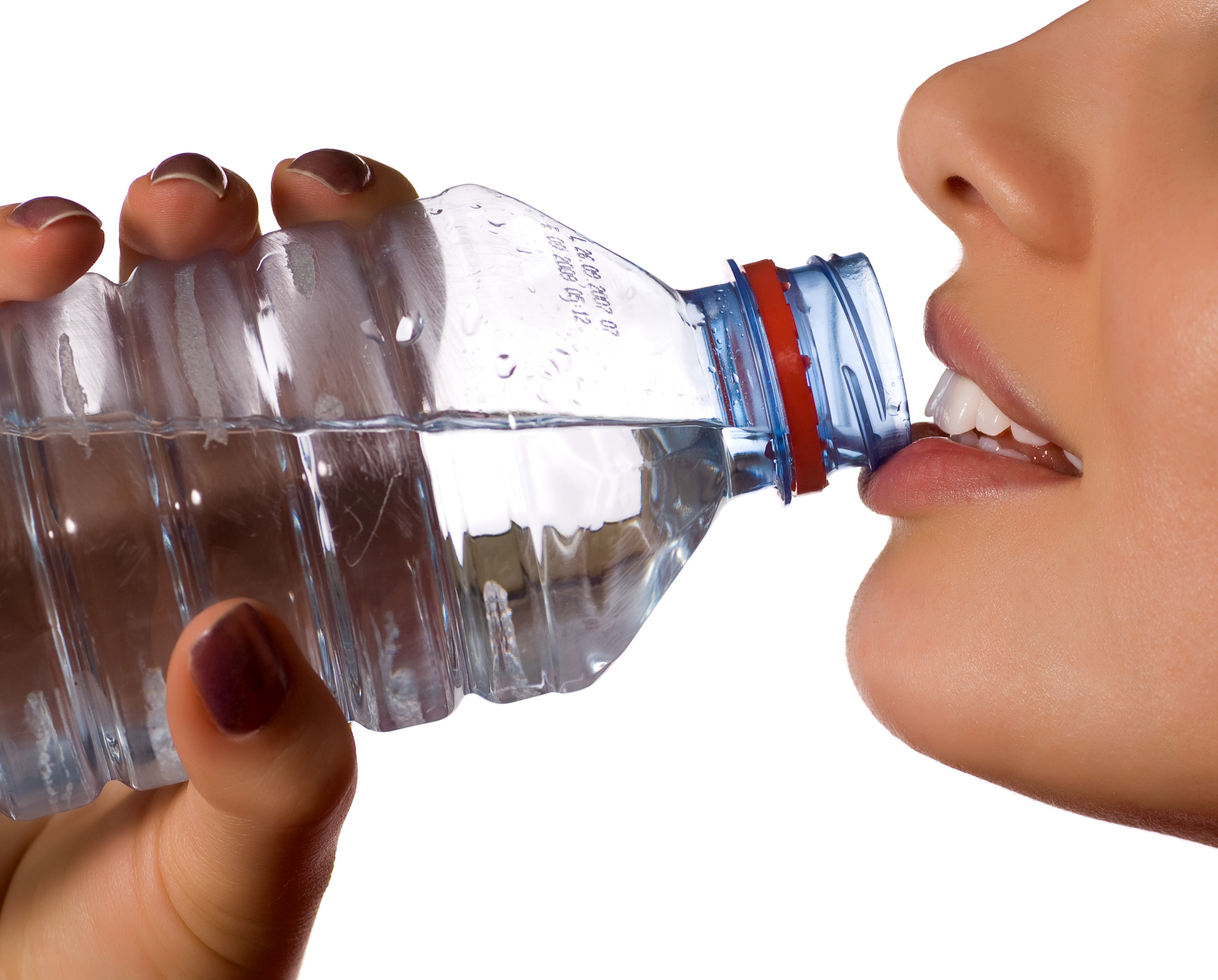 young girl with bottle of mineral water (isolated on white)