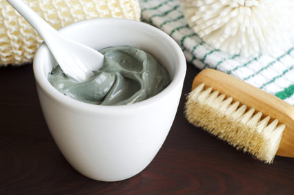 Grey cosmetic clay in a bowl